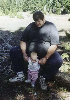 [photo of James Sutfin with baby]