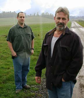 [Broussard brothers standing in field near road in Rio Dell]