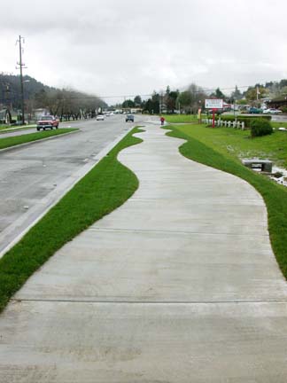 [curved sidewalk with grass margins in Rio Dell]