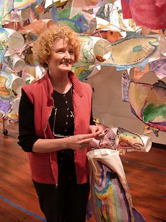 [photo of Becky Evans holding paper fish]