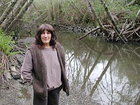 [photo of Marian Coleman near creek]