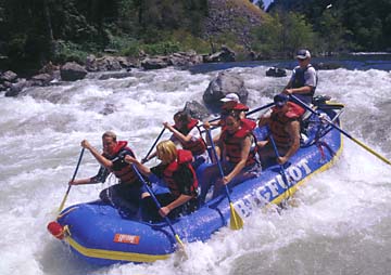 Bigfoot Rafting Company raft holding 7 people, on the river
