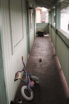 [Bike in hallway of Budget Motel]
