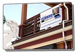 store balcony with Flemming political sign