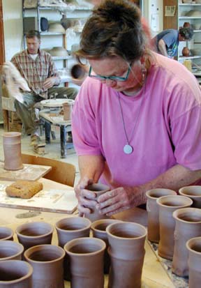 Peggy Dickinson working on one of many drinking vessels