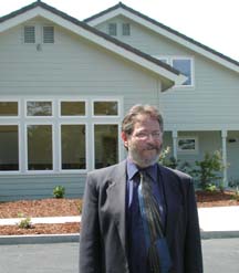 Peter Pennekamp in front of new community center building