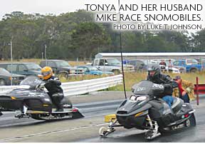 photo of TONYA AND HER HUSBAND MIKE RACE SNOMOBILES. PHOTO BY LUKE T. JOHNSON. 