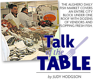 HEADING: talk of the Table, photo of the Alghero daily fish market which covers an entire city block under one roof with dozens fo vendors and flopping fresh fish.