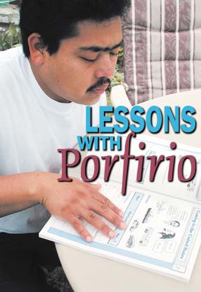 Porfirio looking at a book