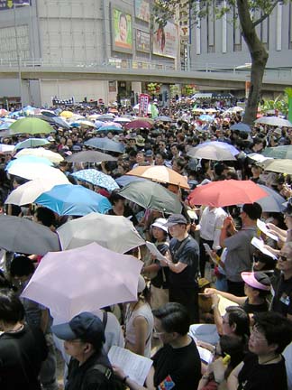 Crowd with umbrellas