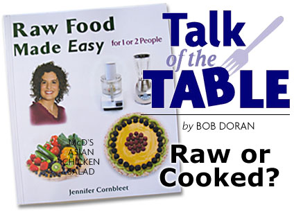 Heading: Talk of the Table, by Bob Doran, Raw or Cooked?  photo of book "Raw food made easy"