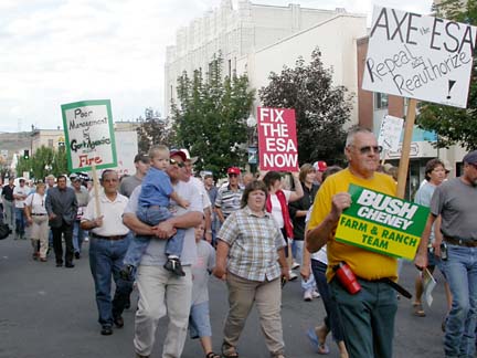 [people marching with signs "fix the ESA now" and "Bush Cheney, Farm & Ranch Team"]