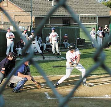 view of batter through cyclone fence