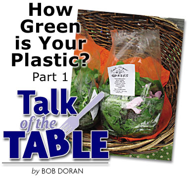 Heading: Talk of the Table, How Green Is Your Plastic? Part 1, by BOB DORAN, photo of salad greens in a plastic bag