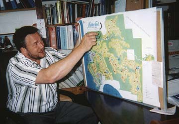 Richard Culp points to a map of Shelter Cove