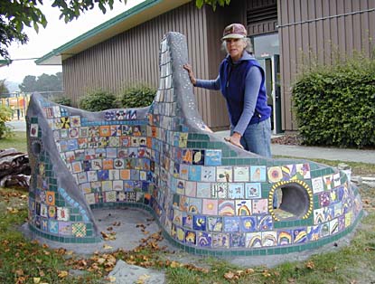 [photo of Donvieve with tile sculpture]