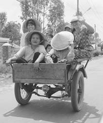 [photo of family in motorized cart]