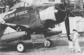 [photo of warplane, mother and daughter]