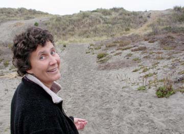 Carol Vander Meer in front of dunes