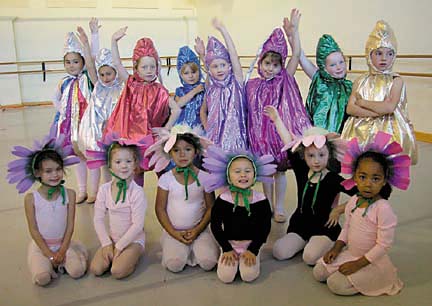 [photo of a group of children in dance costumes]