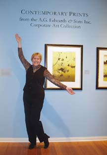 [photo of Shelley Hagen in front of museum art display]