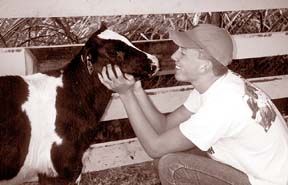 [photo of Dane with calf]