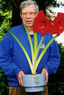 William Burnette with potted red amarylis