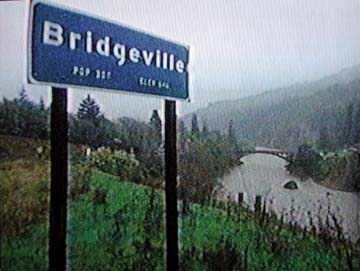 highway sign at Bridgville, with bridge and river in background