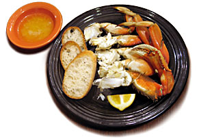 photo of plate of crab legs and butter.