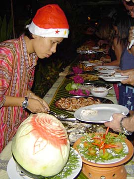 [Thai serving food to guests]