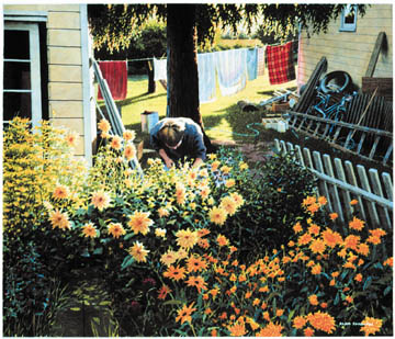 woman in garden with flowers and clothesline