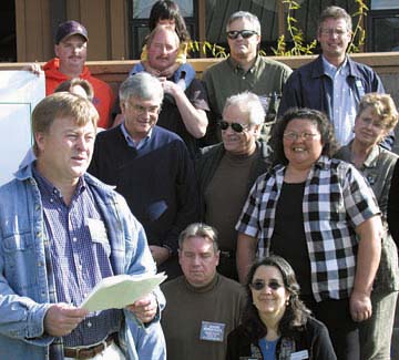 [Mark Wheetley speaking before crowd]