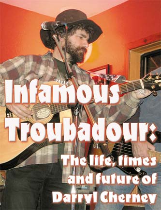 Infamous Troubadour: The life, times and future of Darryl Cherney [photo of Cherney playing guitar]