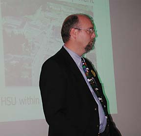 [Bob Schulz giving a Powerpoint presentation]