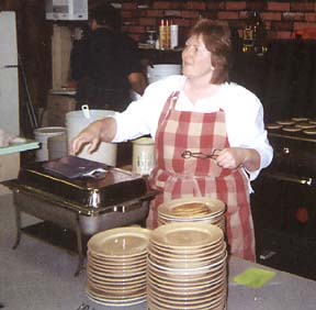 [Maggie Gainer serving pancakes]