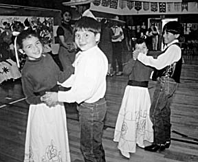 [photo of children dancing]