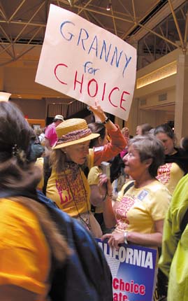 [Debge Hartridge with "Granny for Choice" sign]