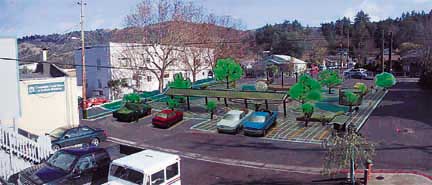 AFTER: artist's rendering showing more trees and different parking layout