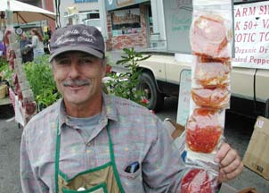 Dezh Pagen at his booth at the Farmers' Market in Arcata