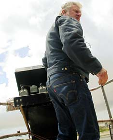 [Captain piloting boat]