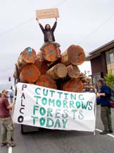 [protestors with signs, on Palco logging truck.]