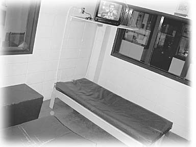 [photo of cots in juvenile hall]
