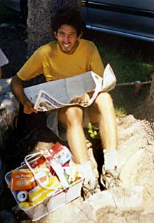 Hiker with his basket of junk food and newspaper