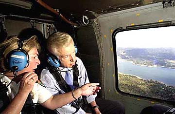 [Tuttle with Gov. Davis in helicopter, looking out window]