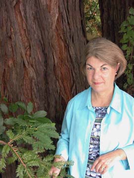 [Andrea Tuttle standing next to redwood tree]