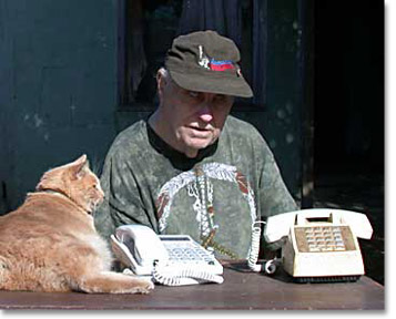 Photo of Kevin the Cat, Harvey Jossem and two troublesome phones