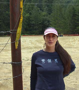 [Deb Alan standing next to barb wire fence]