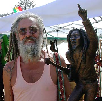 [Vidal Angel with bronze sculpture of Bob Marley]