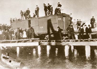 [historical photo of boxcar and crowd]