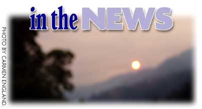 Heading: In the News, photo of smoky landscape, Photo by Carmen England